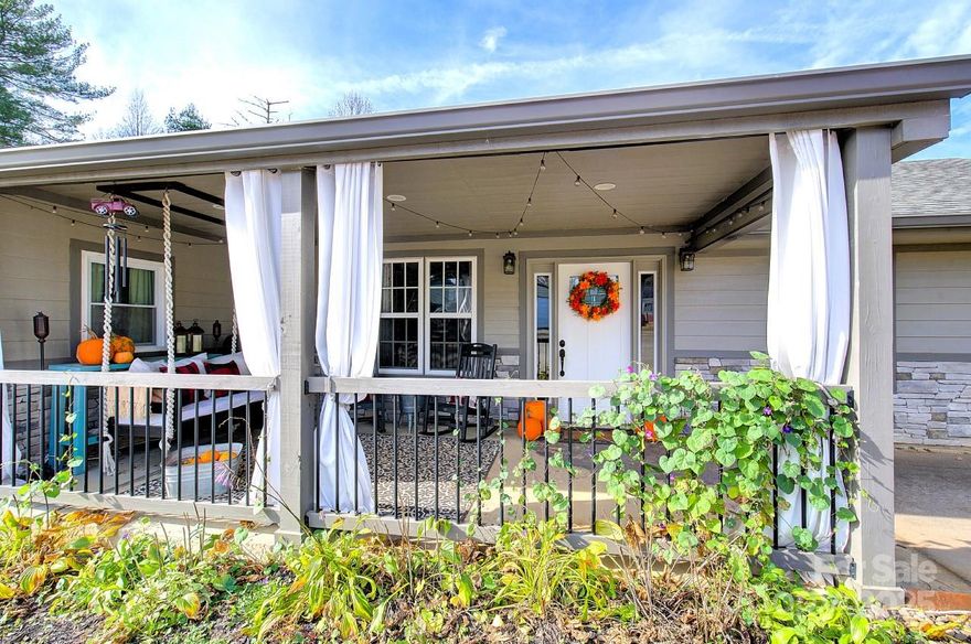 Experience the perfect blend of modern amenities & idyllic charm in this beautifully renovated Hendersonville home. Nestled near scenic vineyards & lush orchards, this property offers a peaceful retreat with all the comforts of contemporary living. Spanning 2300 square feet, the home boasts an open floor plan that includes three inviting bedrooms and well-appointed bathrooms. At the heart of the home, the kitchen is equipped with high-end appliances, beautiful cabinetry and solid stone countertops, creating an ideal space for both cooking and entertaining. The open living areas seamlessly transition to suit any event, from lively social gatherings to tranquil evenings at home.  Additional office space & large laundry complete all the single level living needs.  Back patio & covered front porch provide an extension of living space & an opportunity to enjoy the mountain views & lush back yard every day of the year.  Prepare to turn the key to a house that feels like home from moment one.