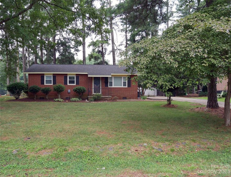 Don't miss out on this great brick home with new LVP flooring in main living areas! Gathering space with wood burning fireplace, white washed hearth and mantel! Updated kitchen with LVP flooring, white cabinets, stainless steel 2 bowl sink & kitchen island with storage. Smooth ceilings, Primary bathroom with dual sinks, tub/shower combo, mud room, half bath & laundry area. Roof was replaced in 2018, HVAC is 3 year old gas pack, electric water heater, the home is connected to city water & sewer. Storage shed & fenced back yard.