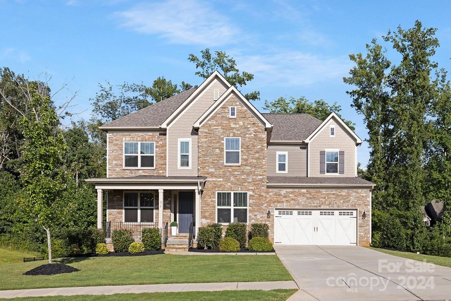 Straight out of catalogue finished basement craftsman is a gem! Home boasts 10ft ceilings, laminate wood floors, open concept dining and family room. Plentiful windows & fireplace in living room make the home picturesque and cozy. Living room is wired for surround sound. Dream kitchen has quartz counters, gas cook top w/ beautiful hood range, elegant cabinets, walk in pantry and bar. Steps from the breakfast area is a covered deck to enjoy scenic & private view. Main level has large guest bedroom w/ walk in closet and private guest bath. New light fixtures throughout. Upper floor has expansive primary suite with spa like bathroom, sweeping walk in closet fit for your pretty things! Secondary bedroom upstairs with it's own private bath, stunning custom shelving and also a walk in closet. Additionally a bonus room, 3rd bedroom and large laundry room with cabinetry, sink, and washer and dryer included. Basement level is finished with expansive outlay, guest bedroom and full bath included.