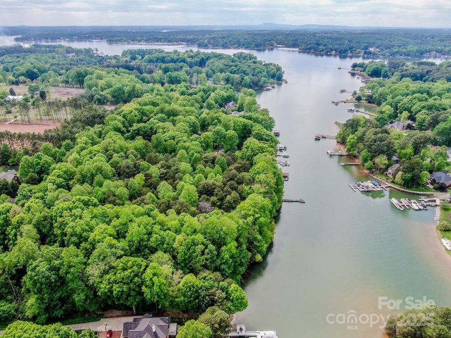 This 7.45 Waterfront subdivision just recorded as Caldwell Cove Subdivision is finally ready for purchase by Developer/Builder/Investor: Sellers have spent months getting everything ready subdividing this beautiful waterfront property and coordinating with Iredell Planning and Development for this Luxury Waterfront Subdivision.  The soil test (attached) has no issues, a tree-lined 30 ft easement named Caldwell Path is in place (ready to be developed in to a private road). Subdivision consist of 3 Waterfront Lots 1.25+ acre(s) each , along with a 4th lot an approximately 2.2 acre parcel in front of the subdivision (256 Templeton) that is deeded to 1/2 acre waterfront private access lot.  All waterfront lots including private access Lot have been looked at by Duke Lake Services and should have no issues for private docks. This is a great opportunity for Small Luxury Waterfront Community to be built. Please see Agent Comments & attachments.