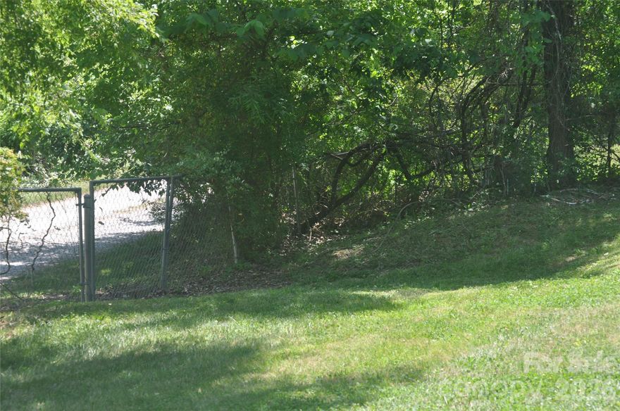 Land in Paradise Point. Ready for you to build your dream home. Already has septic and well. Trailer on land is of no value. The trailer is non livable, Floors are rotting through, seller has put planks down in the trailer to walk on, but please use caution when entering the trailer. There are two sheds that goes with the sell. Cable available. Power is through Duke Power. Trash pick-up is through New Hope Waste Management. Family is still in the process of removing things out of the trailer. Very peaceful area. Refrigerator, stove, washer machine and dryer is in the trailer. Land is fenced in with 3 different gates. Hvac is still in working order.