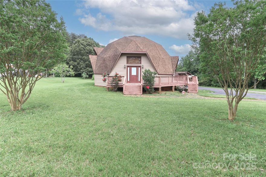 Neat house on 2 acres! Fenced in dog pen. Huge garage/shop with lift , storage Building. excellent location ! Nice kitchen with a lot of cabinet space. Nice size bedrooms. Great room with high ceilings , new carpet, and loft with bedroom above. Extra space in the loft area.Deck off the back and all the way around extra parking. Nice piece of property.