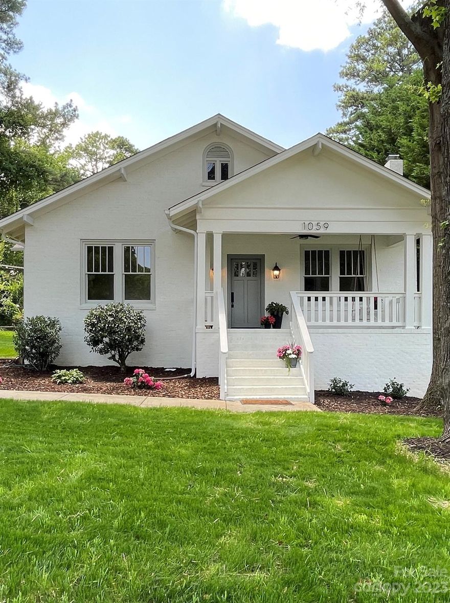You will find charm galore in this newly updated one-level historic all-brick GEM close to Winthrop!  The home features a covered front porch complete w a porch swing for unwinding after a long day, original windows, 10 ft ceilings, original hardwood floors (newly refinished), several French doors, built-ins, butler's pantry, heavy moldings throughout, beautiful antique door hardware, new interior & exterior paint, new 42” soft close cabs, quartz counters, quartz sink with disposal, fingerprint resistant stainless appliances (3 drawer dishwasher & convection range w air fryer feature), recessed lighting, updated bathroom (newly refinished cast iron tub), new HVAC, new ductwork, new hot water heater, upgraded electrical, new insulation (in process), large fenced in yard, extra storage in unfinished basement & large attic with pull down stairs. Feels private yet close to everything w quick access to I77/downtown Rock Hill, No HOA! GREAT Airbnb potential! NEW PRICE improvement.