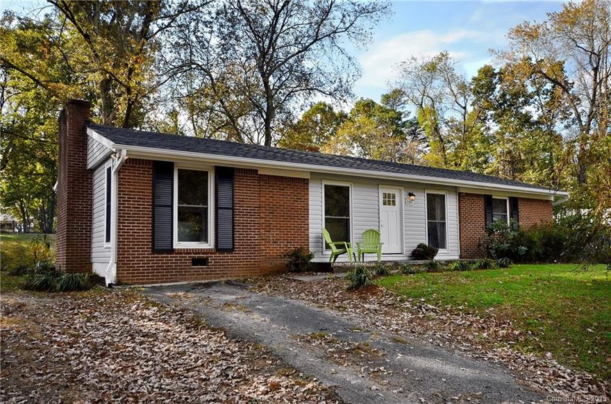 Move right into this completely remodeled home on quiet, dead-end street.  Sweet west side neighborhood just minutes to west Asheville and downtown Asheville.  New roof, gutters, plumbing, HVAC, 200 amp electrical service.  Stunning new custom kitchen w/ granite.  Refinished hardwood floors throughout.  Bonus room with en suite bathroom can be used as master suite or family room.  Large, rear patio with stacked stone wall and fire ring.  Fabulous, level yard with mature trees.