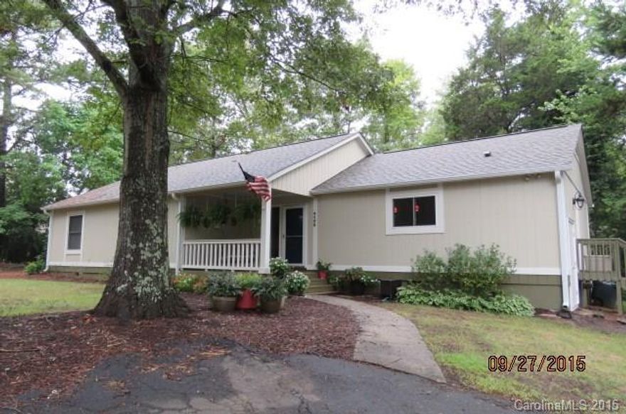 If "move-in ready" & an open floor plan is what you're looking for, welcome home! This is a must-see that's been modernized in every way. Nestled in the trees on a quiet street, this home will end your search. Beautiful site- finished hw floors, new appliances, windows, carpet, roof, paint & smooth ceilings too! Large rocking chair front porch & screen porch are just a few other key features found here. Award-winning schools in a community offering golf, tennis, lake access, trails, no HOA fees!