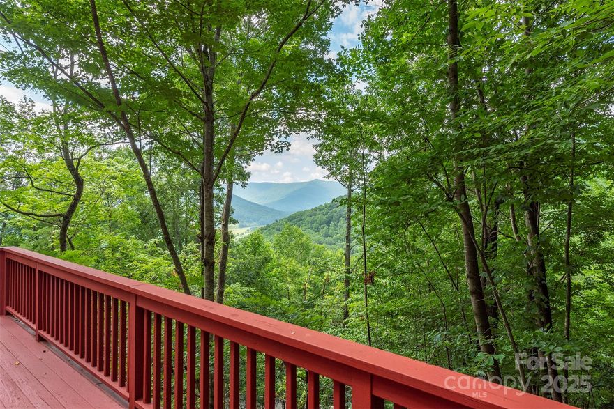 Immerse yourself in the NC mountains with this spacious home in Laurel Ridge. Laurel Ridge is about 10 minutes from downtown Black Mountain and insulated without being isolated. Enjoy a wooded setting with beautiful mountain views in a community committed to the preservation of nature. This architecturally designed home features soaring ceilings and a multitude of windows for an abundance of natural light and a feeling of connection with the outside. Main level living with easy access from the 2 car garage includes a Great Room rising two stories to a Redwood ceiling with craftsman wood and steel trusses, and a custom built kitchen with elevated countertops, well equipped, and is integral to the living area. There is also the main BR, with BA, Laundry, and walk-in closet, and Office/Study with a full BA. Skylights abound for added sunlight.. A second BR and BA fill the large Loft. Basement can be 2nd Living Quarters or added 3rd BR. New kitchenette. Amazing storage areas and workshop.