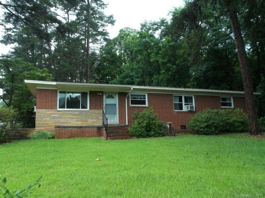 SELLER WILLING TO INSTALL A NEW HEAT PUMP WITH ACCEPTABLE OFFER!!!!!! Roomy Ranch with 255sf partially finished room - would make a great oversized master bedroom!! Clean Carpeted rooms with hardwood floor underneath.  Pine Paneling in Kitchen and Dining Room. Storm doors and ceiling fans. Quiet corner with a dead-end street  --   beautiful pine trees that line the front yard!  Great all Brick exterior with stone accents. Home ready -Nothing to do but just move in and enjoy the peace and quiet.