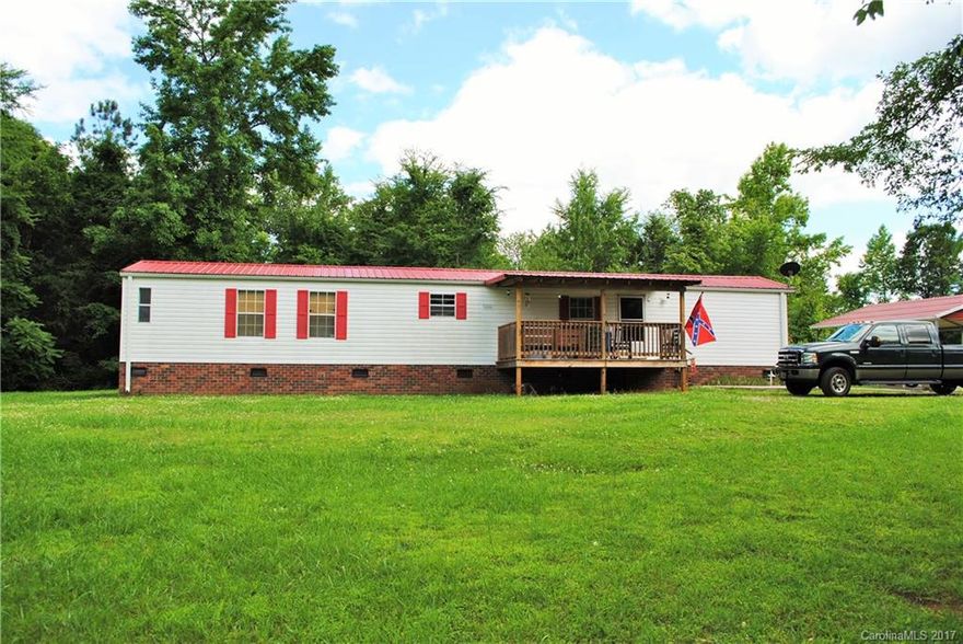 This doesn't come along often... Over 9 acres and a private country setting in East Rowan. Private well and septic. New metal roof in 2015. Detached carport, metal boat shed and building. Covered front porch and back deck. Barn. Lots of wildlife and mature hardwoods.