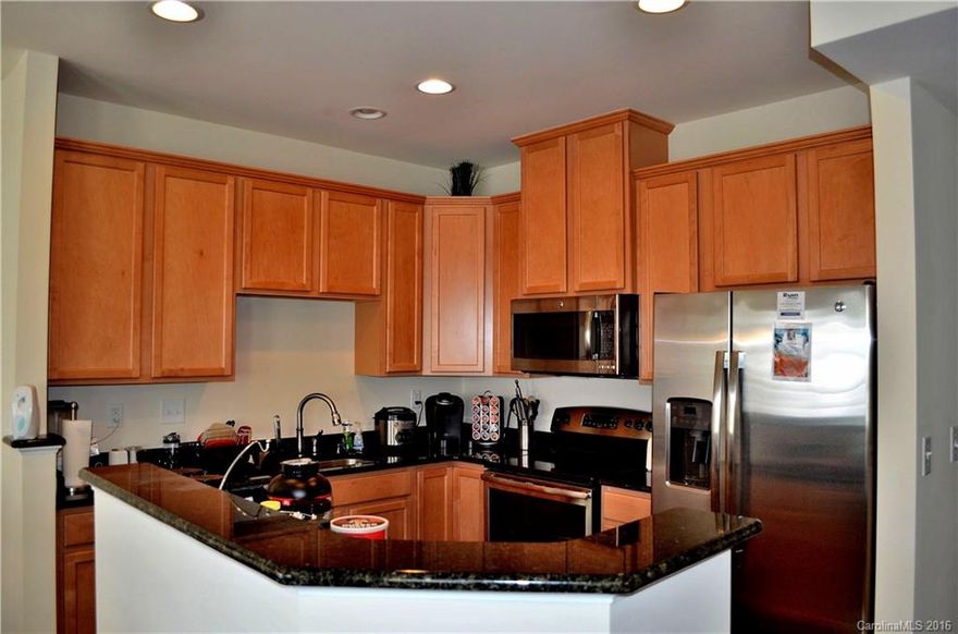 1 year old, S. Chlt.,  Tnhm with 1 car garage ,walk to shop center for dining, groceries, etc...Straight shot to uptown and quick access to Hwys. New Outlet mall 5 minutes away.Hardwoods on main, Custom Euro blinds, Granite/Stainless Appl. in Kit.., Tile B.S..Entertain in enclosed private patio. Ceiling fans, Cable prewire, Guardian alarm system.Closets are oversized.Clubhouse w/ kit./pool table, and workout facility.Custom built pool seasonal. Gated community. Back on mrkt. Priced RIGHT.