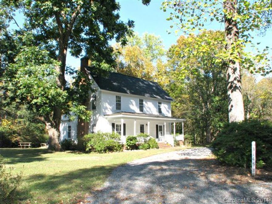 Charming, refurbished farmhouse built in 1908. Heart pine floors and wide rocking chair front porch. Updates in the last 3 years include: dishwasher, HVAC, roof, well pump and exterior painting. Large barn and also storage shed. Very private and nicely landscaped. Per owner, there are wood floors under carpet upstairs.