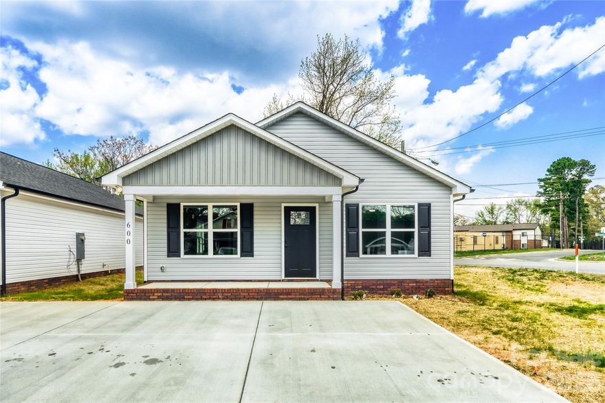 Don’t miss this brand-new construction just minutes from vibrant downtown Kannapolis! This charming home offers a welcoming covered front porch, low-maintenance exterior, and durable vinyl flooring throughout. The bright, open floor plan features 3 spacious bedrooms and 2 full baths, including a private primary suite with a walk-in closet and en-suite bath with dual vanities. A generous laundry room and convenient mudroom add everyday functionality, while modern finishes throughout create a fresh, move-in ready feel. Enjoy stylish, low-maintenance living in a growing area close to shopping, dining, and entertainment.