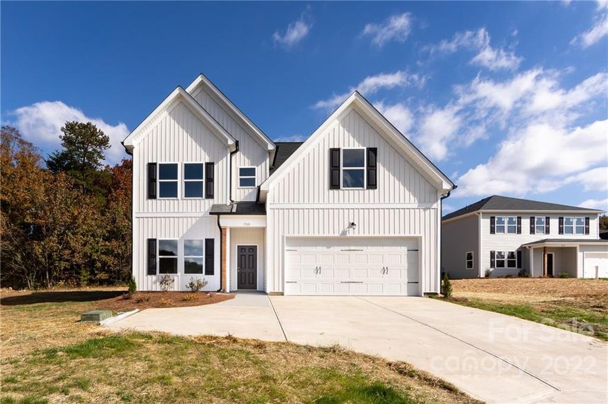 Beautiful new construction in Crystal Lakes.  The home sits on a nice level lot backing to trees and the land to the right of the home cannot be built on.  There is a bedroom and full bath on the main level, electric fireplace, granite countertops,  & covered patio. The primary bedroom as well and 3 of the secondary bedrooms have walk-in closets.
Nice location-close to restaurants and shopping. Picture are of this home that was built in a different location. Completion is targeted for 4/30/2023.