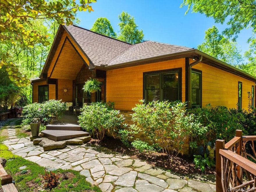 Immaculate light-filled home with open floorplan & 1-level living just 13 minutes to DT Asheville. Meticulously maintained & beautifully landscaped with lots of outdoor lighting. Hardwood floors, new solid core doors, 3-yr old kitchen appliances and water heater. Daylight basement has inside & outside entrances and has been a successful Airbnb. Seller receptive to leaseback. Composite decking with retractable awning on upper level, plus covered lower level deck. Private hot tub area.