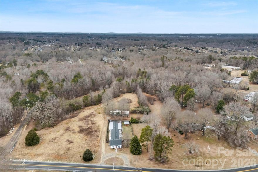FANTASTIC one-of-a-kind property and opportunity on .98 acres located in the heart of Gastonia. This property offers a +/- 730 square foot dwelling/ office/ home with a living/ greeting area, kitchen, den area, separate "room", and bathroom. Connected to the dwelling are two indoor/outdoor areas/ storages formally used as a kennel. There is a mobile home at the back of the property! Theres approximately 150 feet of road frontage. GREAT property for a business and location couldn't be better. The current zoning is R-1 and will require a rezoning or conditional zoning to convert to commercial.