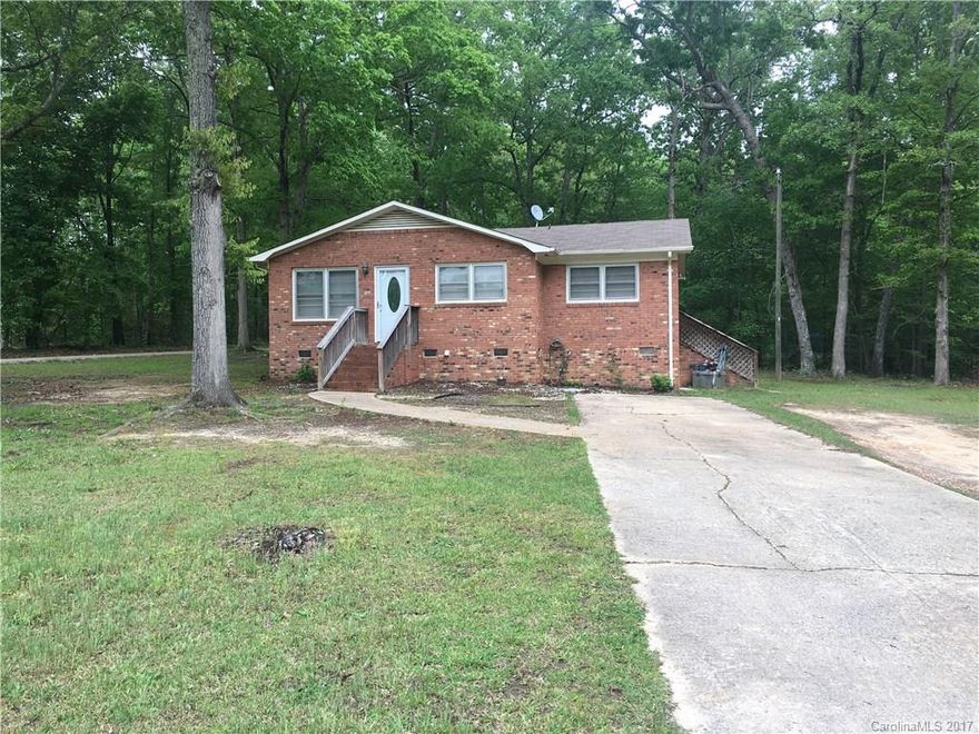 This cute home is ready to move in.  Everything is fresh and clean.  Lots of counter space in the kitchen.  Relax outside on the private, level, wooded lot.
