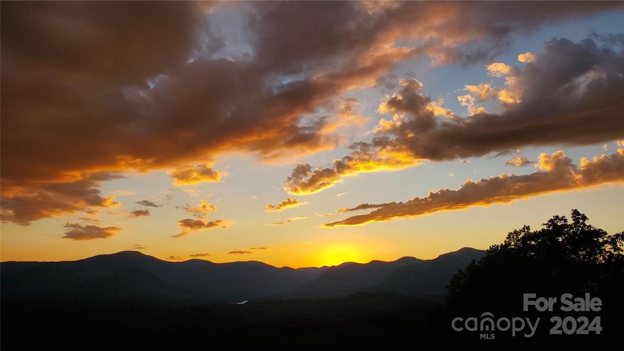 Stunning Home site with Panoramic Views in Vista at Bill’s Mountain!
Discover the perfect spot to build your dream home with this exceptional piece of land, offering breathtaking sunset views of Hickory Gorge and Lake Lure. This gently sloping build site is one of the last available on top of Vista at Bill’s Mountain, providing a unique opportunity to own a slice of paradise.
Enjoy awe-inspiring sunsets over Hickory Gorge and Lake Lure.  Experience both short and long-range views of multiple mountain ranges.  Situated on top of Bill’s Mountain, offering peace, privacy, and natural beauty.
Gently sloping terrain, ideal for constructing your dream home.  Don’t miss out on this rare opportunity to own a prime piece of real estate with unparalleled views and a serene setting. Contact us today to learn more and schedule a visit!  Amenities include gated entry with guardhouse, outdoor pool, clubhouse with fitness, saunas & large entertaining spaces, tennis/ pickle ball courts.