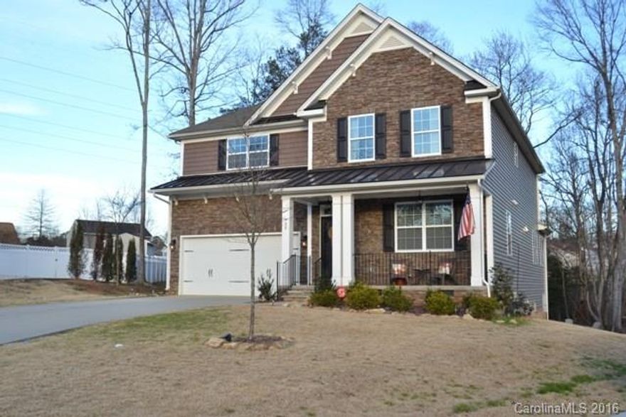 This immaculate 4BR/4BA home is nestled on a large lot in a cul de sac and backs up to the woods. Beautifully crafted w/ coffered ceilings and hardwoods in formal dining room.  Ideal chef's kitchen w/ granite, stainless appliances, and breakfast area. Large bedrooms, including sitting room in master bedroom, and granite vanities in all bathrooms.  Sunroom opens up to the deck and almost an acre of outdoors to enjoy! Luxury living at its best! Minutes from Lake Wylie access!