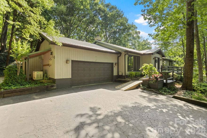 Experience the perfect blend of privacy and convenience in this beautifully maintained home, ideally located just minutes from the charm of downtown Tryon and the quaint shops and dining of Landrum. Inside, the spacious living room welcomes you with rich hardwood floors, custom built-in shelving, a cozy gas log fireplace, and an open view into the bright breakfast area—creating an inviting space for both everyday living and entertaining. The updated galley-style kitchen is both stylish and functional, featuring new granite countertops, a tile backsplash, and stainless steel appliances. The adjoining breakfast area provides direct access to the back porch, making outdoor dining and grilling effortless. The primary suite is a true retreat, complete with hardwood floors, a generous walk-in closet, a beautifully tiled walk-in shower, and private access to the screened-in porch. Step outside to the expansive 30x10 screened porch—sure to become your favorite place to relax. With its charming tongue-and-groove ceiling and peaceful wooded views, it’s the perfect setting for morning coffee or evening unwinding.