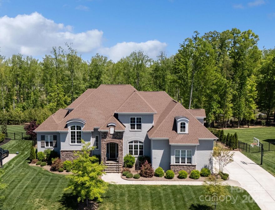 Welcome to one of the largest homes in sought-after Oldenburg! This stunning 2020-built home offers a rare floorplan w/ 2 bedrms on main level. Zoned for top-rated Marvin schools, it blends luxury, comfort & convenience. 2-story foyer features a sweeping staircase flooded w/ natural light. Chef’s kitchen has a massive island w/ farmhouse sink, custom cabinetry, Monogram appliances & seamless flow into family room & breakfast area. Gas fireplace flanked by built-ins, anchors the family rm. Expansive offc w/ custom built-ins & side-by-side desks! Playrm offers flexible living. Main level primary suite feels like a private retreat w/ spa-like bath & 2 huge walk-in closets. Main level guest suite has walk-in shower & large closet. Upstairs: 4 bedrms w/ custom walk-in closets, massive bonus rm & walk-in attic. Covered lanai overlooks pool, spa & outdoor fireplace. Built-in outdoor kitchen w/ grill & bev fridge, fully fenced backyard. Don’t miss this incredible home on over half an acre!