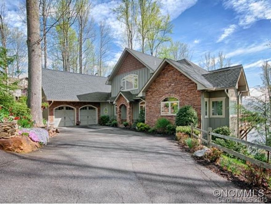 Exquisite style, warmth, functionality and attention to detail.  Stunningly conceived bedrooms with morning kitchen & fireplace in the master, opulent baths, magnificent great room with floor to ceiling stone fireplace, window walls that invite the beautiful setting in, 1,776 sq. ft. of decking overlooking Lake Junaluska, a stone patio with fire pit surrounded by stunning landscape, massive unfinished basement with full bath and great deal more.