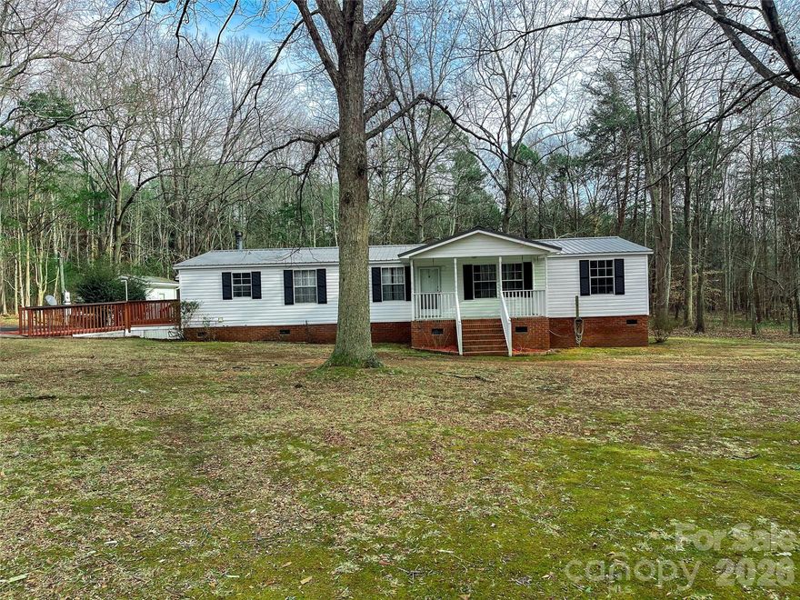 Super nice, very well maintained manufactured home in convenient rural setting on level 1.86 acre lot. 3bd/2ba, large greatroom, separate den with fireplace, sunroom, outbuilding and workshop. Call today to see this property.