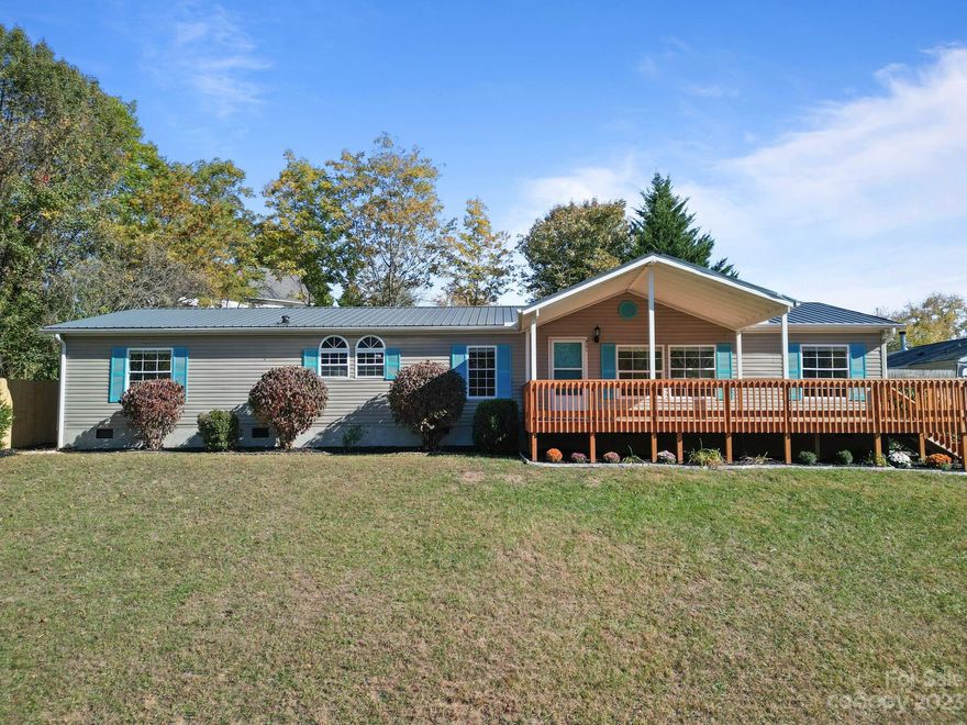Below appraisal!! Must see in person to fully appreciate the work that has been done. You can't find a better home under $300,000.
 One owner first time on the market well maintained 4 bedroom 2 full bath home with extra lot. One mile outside of city limits with lower county taxes. Five minutes to Haywood Road in West Asheville updates including interior paint, new butcher block kitchen countertops, some new lighting. front and back deck, new stucco and concrete patio area. The primary bedroom has a large walk-in closet, bath with double sinks, a garden tub and shower. A large den with wood burning fireplace, living room, open kitchen with tons of cabinet space, laundry room and walk-in pantry. The front porch and deck are ready for leaf looking or just watching the beautiful sunset. Home is MOVE IN READY! Spectrum HIGH SPEED INTERNET available.