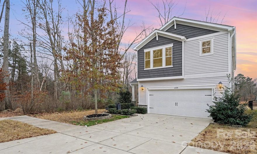 Built in 2020 and beautifully upgraded, this move-in-ready home offers modern design, comfort, and peace of mind. Situated on a private corner lot with wooded views along the back and side, the open floor plan is filled with natural light, ample storage, and thoughtful builder and owner upgrades throughout. The main level features pre-finished wood floors, a spacious dining area with transom window, and a chef-inspired kitchen with white cabinetry, granite countertops, glass tile backsplash, large island with seating, upgraded appliances, and an oversized walk-in pantry. A custom three-season room extends the living space and opens to a travertine patio with seating and a retractable awning—ideal for relaxing or entertaining. Upstairs, the expansive primary suite includes a spa-like bath with a large tiled shower with seat, double-sink vanity, and linen closet. Laundry is conveniently located near the primary suite and upgraded with tile flooring, lower cabinets, and a folding table. Two secondary bedrooms feature walk-in closets, and the secondary bath offers tile flooring, a large double vanity, and linen storage. Additional upgrades include new pendant lighting, six ceiling fans, upgraded Berber carpet, added half-bath vanity, LeafGuard gutter system, and four motion-sensor lights. A two-car garage, long driveway, 0.15-acre lot, transferable builder structural warranty, and energy efficient Meritage built home with spray insulation and fresh-air system add lasting value- see attachments for builder details and owner upgrades. Convenient to shopping, dining, Hwy 485, parks, and public golf. Watch the video, tour in person, and come see why this one stands out.