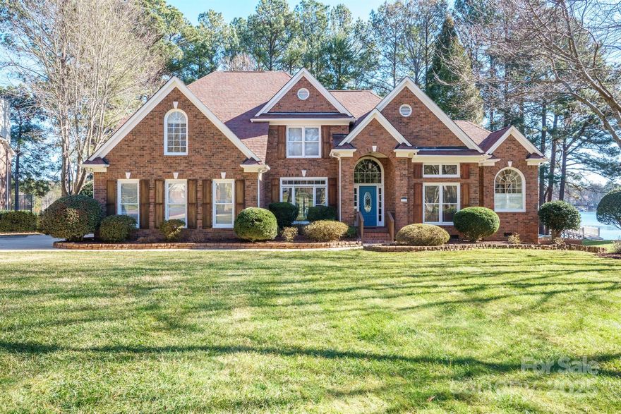 This spectacular waterfront home in The Harbour at the Pointe is destined to impress with its remarkable views of Lake Norman from INSIDE AND OUT! Well loved by its original homeowners, this full brick 4 bed/3 and a half bath John Wieland build sits on a cul-de-sac lot in one of the most desirable neighborhoods in the area. No expense was spared in the luxuriously remodeled kitchen that prides itself with Brazilian quartzite countertops, Spanish tile backsplash, sizable island and custom cabinetry. The primary suite on main level boasts two walk in closets and a stunning bathroom renovation with a walk in steam system tile shower, heated tile floors, quartz countertops and a free standing tub. Upstairs you will find 2 more updated bathrooms and 3 bedrooms, one of which currently serves as bonus room with an adorable kitchenette. This home also showcases stunning ceilings, a wine cellar, a hot tub that coveys, recent paint, a newer HVAC and an encapsulated crawl space. She's a beauty!!!