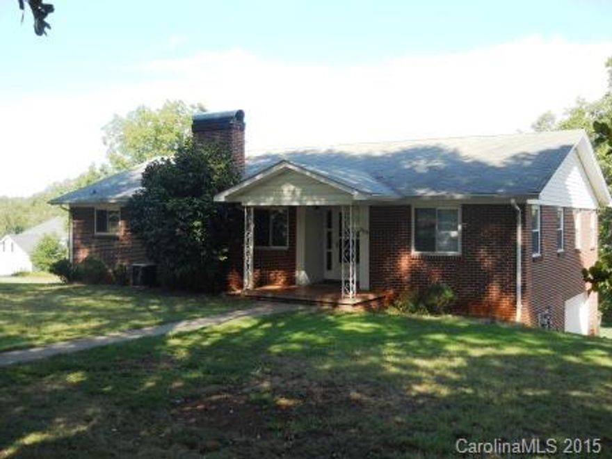 Located near shopping, dining and Lake Hickory this wonderful 3BR/2BA brick ranch with basement gives you convenience of location with 1.52 acres. Refinished Hardwood floors, 200 amp electrical panel. Huge kitchen w/appliances, large living area w/fireplace, office/den with built-ins. Double garage in basement, large driveway. Home has public water and well (well needs a new pump). The well would be a great source of water for irrigation. Roof recently updated.