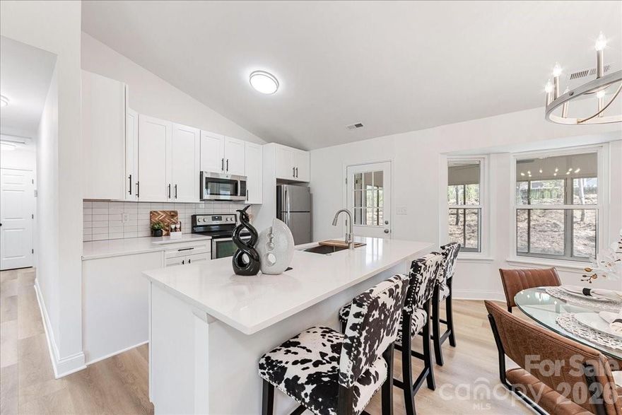 Welcome to this beautifully remodeled 3-bedroom, 2-bath ranch home, where modern updates meet timeless comfort. Nestled in an up-and-coming neighborhood, this home offers the perfect blend of style, convenience, and future value. Step inside to discover a bright, open-concept layout featuring new flooring, fresh paint, and abundant natural light throughout. Brand new Roof, Siding and Windows! The fully updated kitchen is a standout, complete with sleek countertops, contemporary cabinetry, and stainless steel appliances—ideal for both everyday living and entertaining. The spacious primary suite provides a relaxing retreat with a fully renovated en-suite bath, while two additional bedrooms offer flexibility for family, guests, or a home office. Both bathrooms have been thoughtfully redesigned with modern fixtures and finishes. Outside, enjoy a generous yard with plenty of room to garden, play, or create your own outdoor oasis. With updated systems and finishes throughout, this home is truly move-in ready. Located in a rapidly growing area, you’ll appreciate easy access to Uptown and major highways, making this not only a great place to call home, but a smart investment as well.