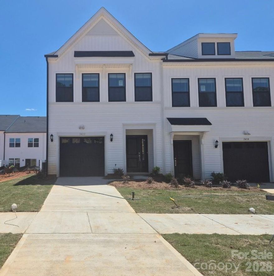 This end unit two-story townhome includes three bedrooms and two-and-one-half bathrooms. Immediately inside the entrance, a hallway leads past the staircase and half bathroom and into the open concept great room with a fireplace, eat-in, kitchen, and patio. Upstairs, the primary suite features a walk-in closet, a tray ceiling, and dual vanities. A laundry closet is located just outside of the primary suite for ultimate convenience. Two secondary bedrooms and one full bathroom are also located upstairs. A one-car garage along with a bench and cubbies complete this floor plan. Additional windows on both levels ensure abundant natural light in the home.