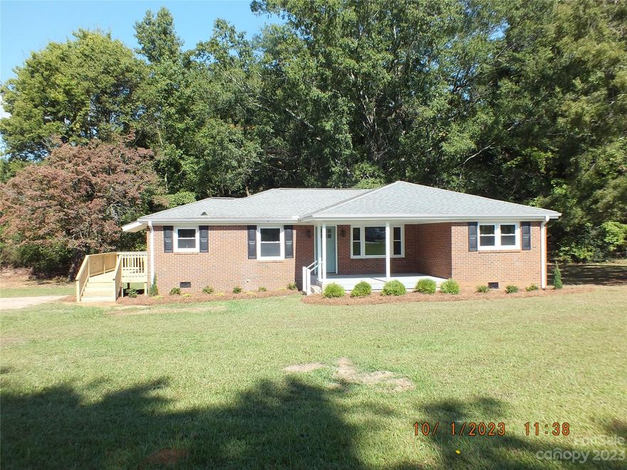 Welcome to your new home,, this home has been completely renovated to include, roof, windows, plumbing, electric, new sheetrock, flooring, new kitchen with stainless steel appliances, laundry room closet, new baths with large stand up shower and one with tub. Open floor plan giving plenty of room for living space. There are 4 bedrooms if needed, or you could put up a door and use the front to bedrooms and bath as a master suite or office. This home is freshly painted and the flooring is beautiful bamboo. Going outside enjoy the large 16x12 covered front porch or the new deck on the side. The back yard has a large trees that gives the whole yard lots of shade, great for outdoor events. Located in Bufford school district this home has  something for everyone.