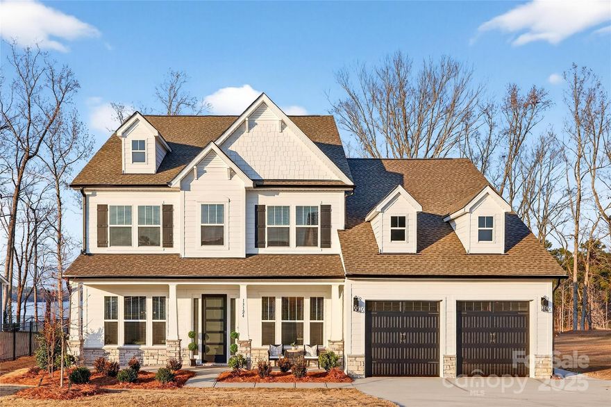 Discover the Kensington plan, a stunning semi-custom home offering over 4,100 sq. ft. of thoughtfully designed living space on a near half-acre, lakefront, dockable homesite. This quick move-in opportunity features 4 bedrooms, 3.5 baths, and extensive upgraded features throughout. The main level showcases a private study with beamed ceiling, formal dining with tray ceiling, and an open-concept great room with gas fireplace. The gourmet kitchen is equipped with a quartz island, porcelain farmhouse sink, stainless steel appliances, vented canopy hood, and butler’s pantry. Enjoy seamless indoor-outdoor living on the rear screened porch. The primary suite on the main level offers a spa-inspired bath with garden tub, tiled shower, dual vanities, and walk-in closets. Upstairs includes two additional bedrooms, a game room, bonus room, and two full baths. Located in the Edgewater Golf Course Community with pool, clubhouse, boat docks, and walking and biking trails—an exceptional opportunity for comfort, flexibility, and lifestyle.