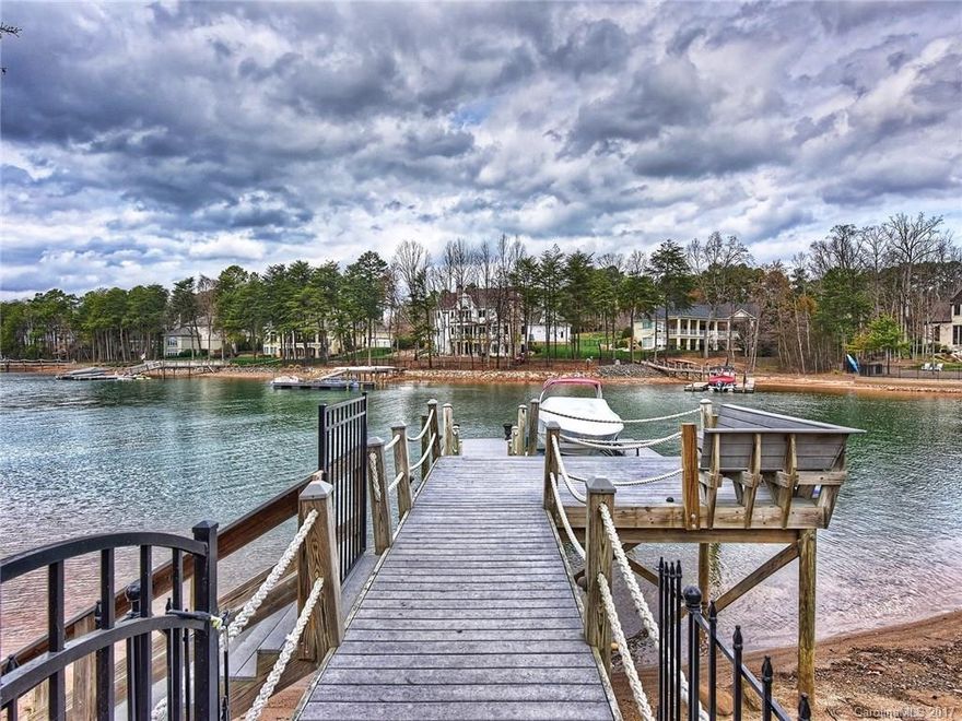 This is the ultimate lakeside living home w/nearly 7,500 sq.ft. on 3-levels designed for both formal gatherings and leisurely entertainment. Built by Arcadia Homes w/magnificent views of Lake Norman from nearly every room. Located on a deep water cove w/private pier and boat lift. This home features 5 BDRMS, gym, sauna/steam room, wine cellar, outdoor spa w/water & fire feature, outdoor kitchen & entertainment area with fireplace. Min. Membership required to Golf Club.