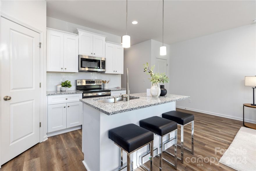 Welcome to this exquisite new construction townhome by Northway Homes, where modern design, functionality, and luxury converge. Situated among other new builds, this home features three spacious bedrooms, each designed for relaxation. The primary suite offers a private retreat with a luxurious ensuite bathroom and ample closet space. With two full bathrooms and an additional half bath, convenience and style are paramount. Each bathroom is equipped with contemporary fixtures and finishes, providing a spa-like experience at home. The heart of this residence is its expansive open floor plan, seamlessly connecting the kitchen, dining, and living areas. Perfect for everyday living and entertaining, this design offers both flexibility and flow. Unlike other nearby townhomes, this Northway Homes property has no HOA fees.