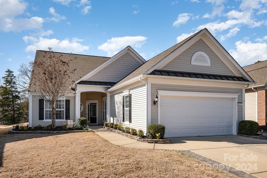 Welcome to the popular Surrey Crest w/loft, located in the amenity rich Sun City Carolina Lakes. This 3BR/3BA home features a front porch, crown molding, a spacious primary suite on main floor w/trey ceiling, ensuite bathroom w/dual sink vanity & garden tub. The great room has beautiful hardwood flooring, a gas-log fireplace. Enjoy main level living w/a guest bedroom, hall bath,a large sunroom,office w/built-in bookshelves, walk-out to the paver patio w/awning, sitting wall, private wooded back yard w/a partial view of the lake. The kitchen boasts stainless steel appliances, granite counter tops, ceramic backsplash, hardwood floors. Upstairs loft area, new carpet and offers a bed/bath & additional space for a 2nd living area/game room. This home offers an abundance of storage space, attic floor, extended garage w/epoxy floor, & 18” driveway extensions on both sides, blinds throughout home, front/back Electronic Schlage locks, Electric/Wi-Fi thermostats.  Don't miss this opportunity!