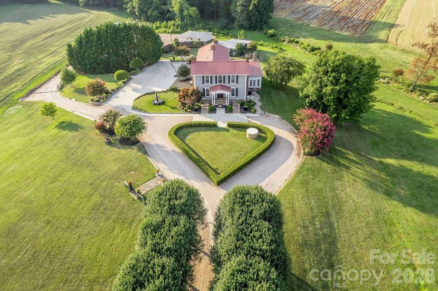 Beautiful wedding and event venue located in the countryside near China Grove, approximately 30 miles north of Charlotte. Originally constructed in 1859, the property blends historic character with modern infrastructure and currently operates as a regional event destination.
This offering includes the improved real estate and presents the opportunity to continue operations as a wedding and event venue, hospitality concept, private retreat, or adaptive commercial use (subject to zoning verification).
Situated on over 7 picturesque acres, the estate features landscaped gardens and multiple revenue-capable event spaces, including:
The Magnolia Room for intimate gatherings,
Formal Dining and Living Rooms adaptable for ceremonies or receptions,
A 40' x 60' Grand Champ tent designed for large wedding receptions and celebrations.
The main structure includes 3 bedrooms, 2 full baths, and 2 half baths, allowing for owner-operator use or guest accommodations. The renovated kitchen supports event operations and catering needs, featuring a Zline 6-burner stove with double oven, beverage center, ice maker, trash compactor, and large center island.
Additional commercial-supporting improvements include:
Vendor cottage (preparation and storage),
Groom’s lounge,
Greenhouse,
4-stall barn with dog run,
Workshop with covered parking,
RV covered storage with 50-amp service,
2-car detached garage and additional covered parking.
Hot tub amenity.
The layout and improvements support continued event operations, hospitality expansion, or conversion to a private estate with commercial-use potential.
Whether operated as an established venue, repositioned for hospitality use, or held as a strategic investment,  This wedding venue offers a rare blend of historic architecture, flexible infrastructure, and income-producing potential in a peaceful yet accessible setting.
Buyer to verify zoning, permits, and intended use.  No septic permit has been found with the county.  Listing Firm & seller have no record of permits pulled.