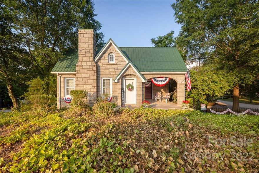 COME SEE this immaculate MOVE-IN READY HOME with TONS OF SPACE! With beautiful oak floors upstairs, a remodeled bedroom with gorgeous, vaulted cedar ceilings and cedar closet, 2 living rooms, fireplace, and an updated kitchen with granite countertops and a HUGE 20x20 deck. The fully finished basement has beautiful blue slate floors, a living room, another fireplace encased in stone, 2 bedrooms, a kitchenette, laundry and blind-encased french doors leading to the outside. Basement/bedroom 3 would be PERFECT for a multi-generational family with its own entrance, bathroom, and kitchen space. Parking area could be maximized by using area below deck. 100% HARD TO FIND GRANITE EXTERIOR, the POSSIBILITIES ARE ENDLESS with this property!