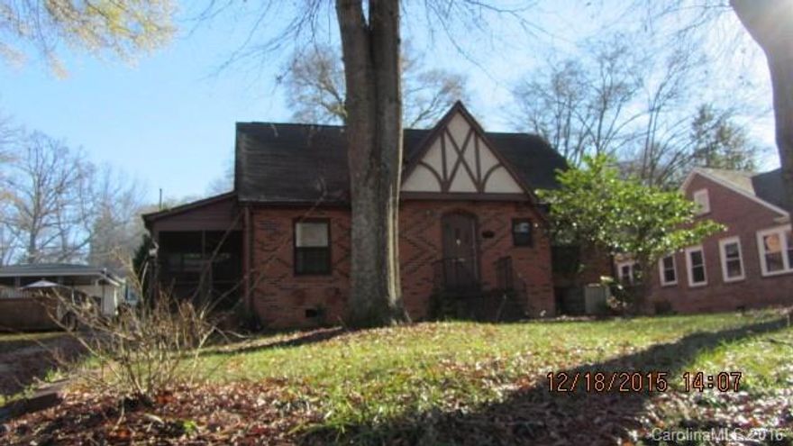 Charming 1.5 story Tudor home with a detached 2 car carport. Outside entrance to basement. Screened side porch. Large kitchen, LR, DR bedroom and an office is on the main floor. 2/3 bedrooms upstairs with a half bath. Great established neighborhood. Well landscaped spacious lot. House needs some updating and TLC but priced accordingly. Lots of storage in the basement and walk-in attic.