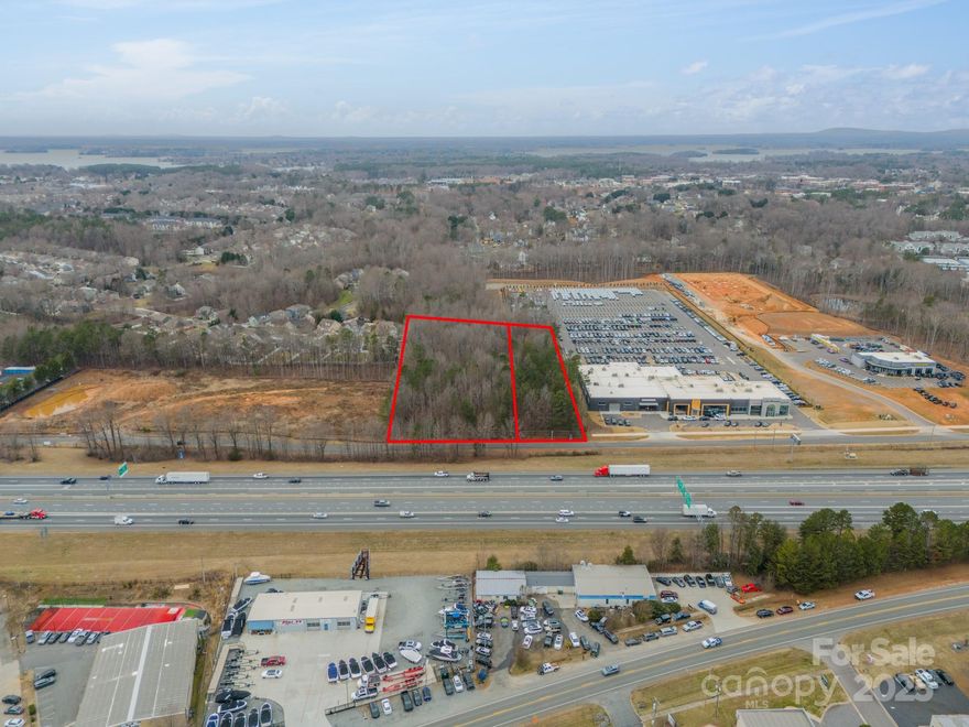 2.85 and 1.26 acre site on HWY 77 near the  new Jeep Dealership in Cornelius.  This section has an automotive overlay and would likely be approved for a car dealership. It is also suitable for a large office development.  Any plan is subject to approval by the town of Cornelius.  The lot nextdoor consisting of 1.26 acres is also available for a total of 4.12 acres.  The smaller lot was rezoned for a 10,000 ft boat dealership, but can be rezoned with the adjoining lot.  Price increased due to combining the two lots.