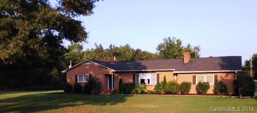 Beautiful all brick ranch home with updated landscaping on over 3 acres. French door leads to large, expansive deck.  Seller improvements include kitchen appliances, HVAC, roof, landscaping, and back deck.  Detached building with 220 power being sold in as-is condition. Air compressor in detached building, riding lawn mower, and refrigerator in Kitchen can convey with acceptable offer. 24 hour notice required for all showings to remove dogs.