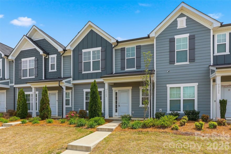 Move-in ready and beautifully appointed, this like-new 3 bedroom/2.5 bath townhome (built in 2023!) is ideally located in the highly desirable Steele Creek area. Inside, you'll find an inviting open-concept main level, where durable and stylish LVP flooring flows seamlessly throughout. The spacious, light-filled living area transitions effortlessly into the dining space and well-equipped kitchen, featuring stainless steel appliances, ample cabinetry and countertop space, and a large pantry, perfect for both everyday living and entertaining. Upstairs, the primary suite offers a true retreat with elegant tray ceilings, a spacious en-suite bath with dual vanities and a large walk-in closet. Two additional generously sized bedrooms share a full bath, while a conveniently located laundry closet completes the upper level. Additional highlights include an attached one-car garage and driveway, providing ample parking and storage. Enjoy unbeatable convenience with close proximity to the Charlotte Premium Outlets, the U.S. National Whitewater Center, CLT Airport, Topgolf, and an abundance of shopping, dining and major highways. Community amenities include a dog park, pool, playground and outdoor areas throughout. The HOA enhances low-maintenance living by covering lawn care, internet, and cable, making this home as effortless as it is exceptional!