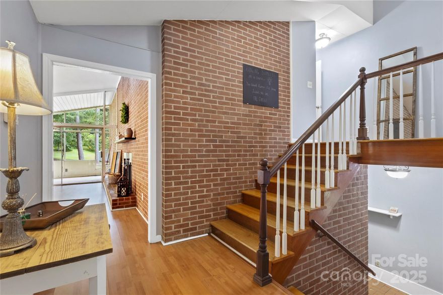 Welcome to charming Lockhart, SC! Nestled on just under four acres of lush, private land, this spacious split-level home offers the perfect blend of comfort and tranquility. The inviting screened porch welcomes you into a light-filled layout featuring expansive windows, original hardwoods and charming details throughout. The generous kitchen and dining area overlook the serene backyard—ideal for gatherings or quiet mornings. Enjoy multiple living spaces, including a cozy den with a fireplace and a versatile lower-level flex room. The large lot provides ample space for outdoor fun, gardening or future expansion. With mature trees, a long private drive, attached garage and two outbuildings, this property offers peaceful living just minutes from town amenities. A rare find with room to make your own! Whether you’re dreaming of a mini homestead, extra storage, or a workshop, the possibilities are endless. Schedule your tour today.