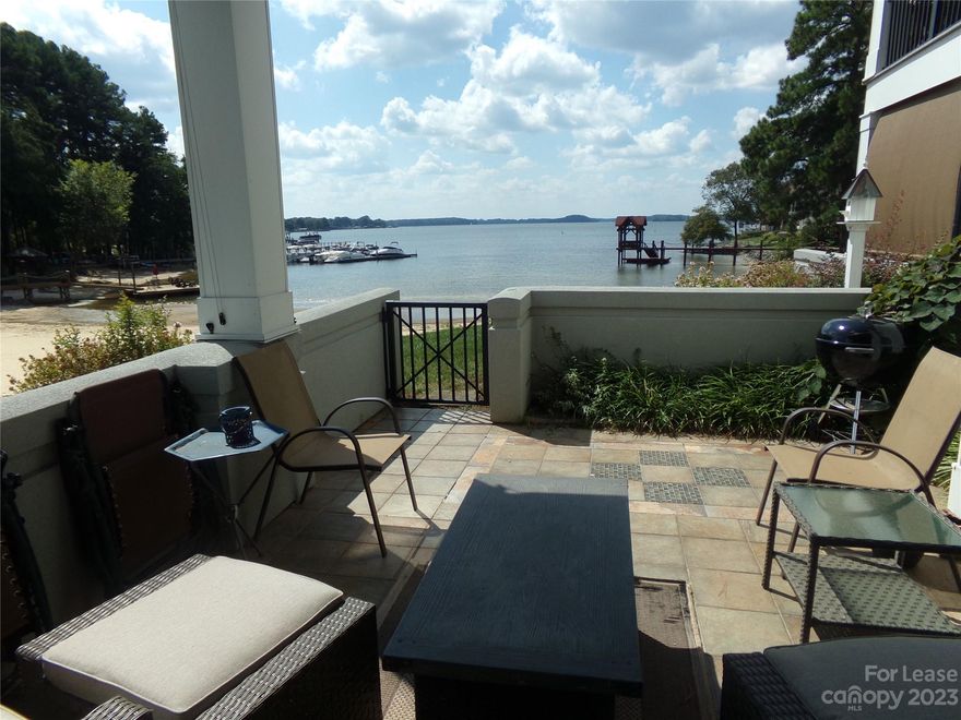 You will love this waterfront, ground floor, open floor plan, 2-bedroom condo.  This home is updated and fully furnished. Kitchen with granite and gas stove.  Gas fireplace in living room. Enjoy watching the Lake Norman Sunsets on the back porch. Sandy beach with floating dock. Community pool and tennis.  Feel like you are vacation every day.  Walking distance to Birkdale Village.  Close to shopping, golf and I-77. Washer and dryer included.  All utilities included.  Not pet friendly and no smoking. Minimum lease is 6 months.  Landlord would consider unfurnished with a one year lease.