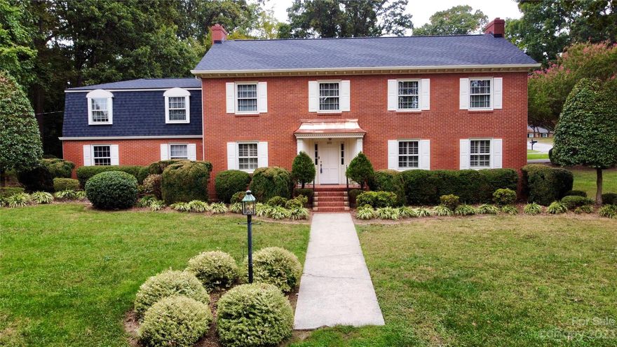 Discover a stunning, full brick home in Kannapolis, cherished by three generations and located a mile to the uptown social district, the Amtrak station, and thrilling Cannon Ballers games! The home, notable for its copper awning and charm, boasts hardwood floors, custom built-ins, crown molding, and recent upgrades including a new roof (September 2023), granite countertops, and stainless-steel appliances. With 5 beds, 3 baths, spacious rooms bathed in natural light, and a tranquil patio, it melds comfort and functional living. Additional adjacent lots (409 Bost St, 402 & 404 Walker St) can also be purchased, preferably as a package deal. Situated in an established neighborhood, this rare find is ready for a new family, all close to the new city center and a short commute to the Charlotte metro area!