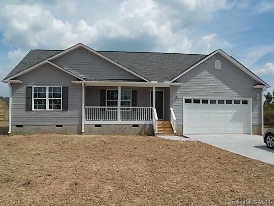 Qualifies for 100% USDA Financing!! Beautiful New CONSTRUCTION with 3 BR/2BA + 2 car garage on 1 acre! Split bedroom plan. Large spacious eat-in kitchen with stainless appliances inc. built-in microwave, smooth-top range, and dishwasher. Vaulted ceiling in GR, Trey ceiling in MBR. Double vanity (raised height) and garden tub in MBA. Covered front porch, rear deck, upgraded carpet, ceiling fans in all BR's. READY NOW!