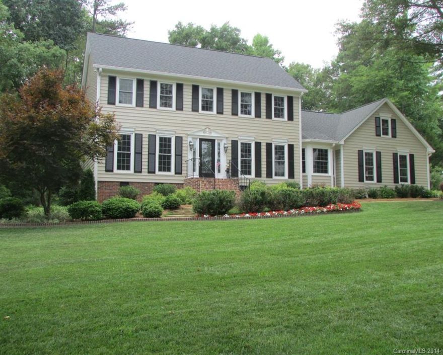 This beautiful Fort Mill colonial home in Olde Williamsburg has 4BR/3BA on 1.04 acre corner lot providing plenty of privacy.  Features cherry wood floors, carpet, new vinyl siding with low maintenance, 3 year old roof, new water heater and well pump among many upgrades.  Formal dining room and living room with gas fireplace. Ample storage and well-manicured yard in a quiet friendly neighborhood.  Wired for cable. Conveniently located between I-77 and 521.