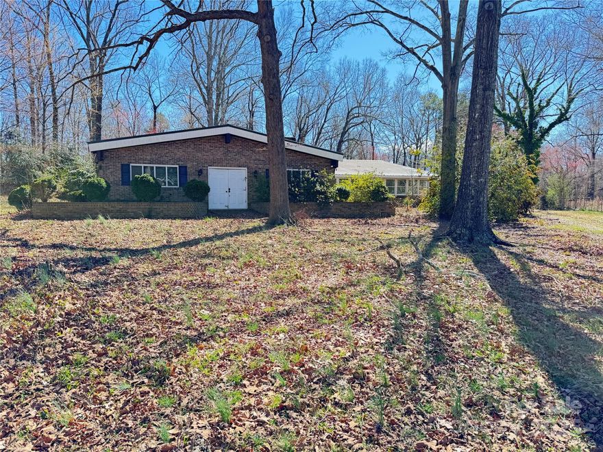 Awesome Property being sold AS-IS large estate home with open areas.  Two oversized out building in rear.  Wooded lot Bank approved short sale.  You just have to visit this property to appreciate.  Seller has accepted an offer just waiting of final approval from the bank.  thanks
