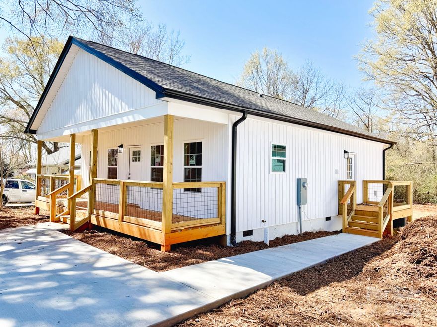 Great open floor plan and one-level living in a brand new home waiting for you! This lovely home features granite counter tops, quiet close cabinets and easy care vinyl plank flooring. The primary bedroom has an en suite bathroom, walk in closet and sliding doors leading to the back deck. The exterior of the home has been designed for low maintenance with minimal yard work. Conveniently located a short distance to downtown Forest City and shopping.