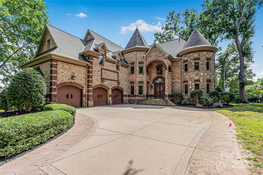 Located in the prestigious gated community of Chatelaine in Waxhaw, this exquisite 3-story Old World Architectural Style Home showcases gorgeous stonework on the exterior and an interior where every room offers something unique from soaring cathedral ceilings to custom wood finishes and detailed moldings throughout. Three floor-to-ceiling stone fireplaces anchor the living rooms on the main and upper levels as well as the den, creating warmth and elegance in every gathering space. The gourmet kitchen boasts custom cabinetry, high-end granite countertops, and stone backsplash, while the primary suite features a spa-inspired walk-through all-stone shower and whirlpool tub. The main floor includes a private office, and the third floor offers an extra-large recreational room perfect for a movie theater, game room, or gym, along with a bonus room and half bath. Outside, enjoy serene pond views and mature landscaping, with community walking trails and a picturesque pond just steps away.